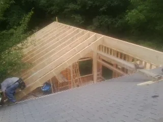 Framing a new roof addition that ties into an existing shingle roof in Prichard